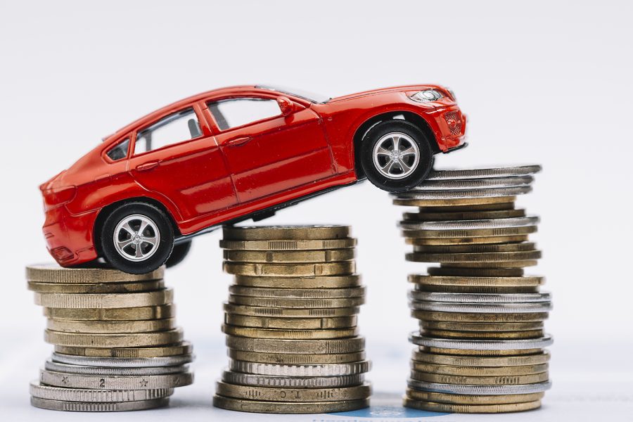 toy-red-car-stack-increasing-coins-against-white-background LR